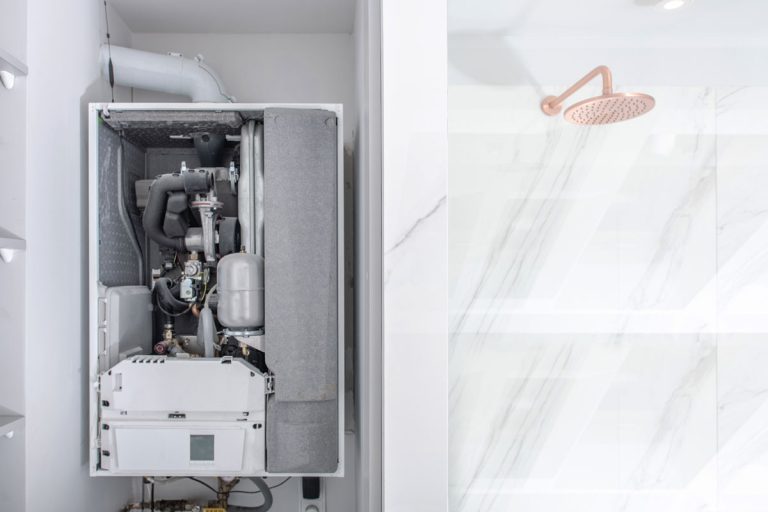 Broken Modern Water Gas Heater Next to Shower Cabin Inside Elegant Clean Bathroom Interior., Can You Paint A Rinnai Heater?