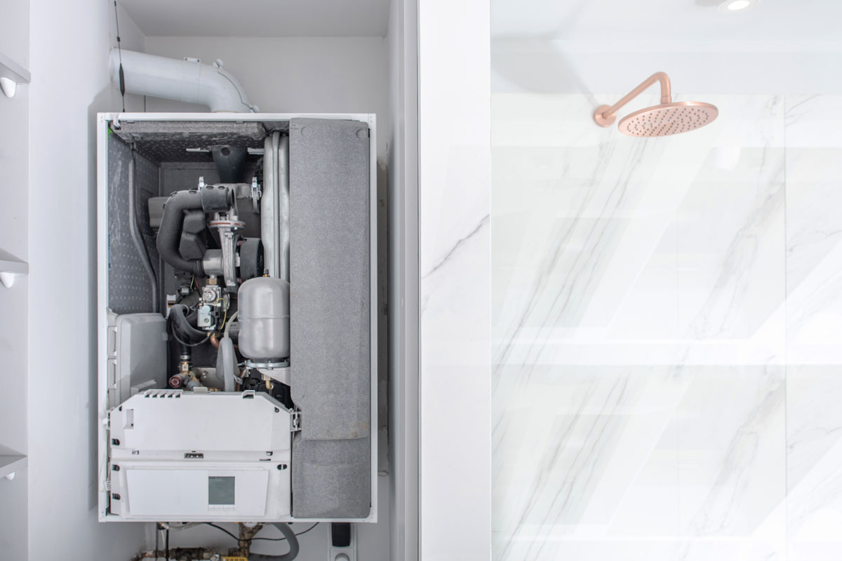 Broken Modern Water Gas Heater Next to Shower Cabin Inside Elegant Clean Bathroom Interior