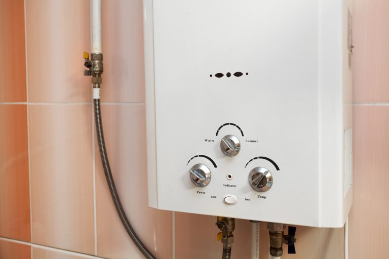 Close up of Gas water heater in the kitchen, My Rinnai Recirculation Is Not Working - Why? What To Do?