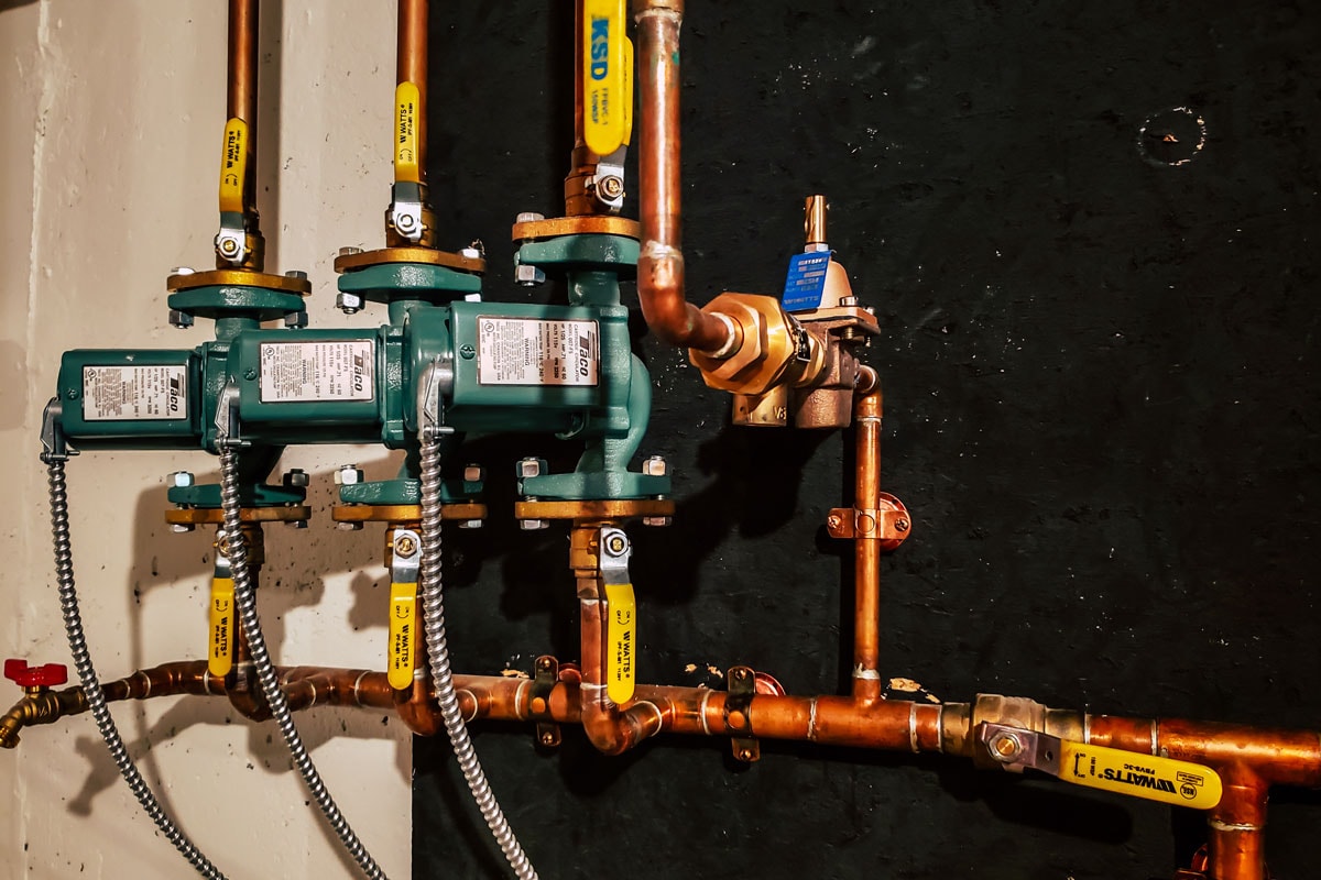 Finished installation of multiple Taco 007 circulator pumps on a very neat copper piping system for a high efficiency wall mounte