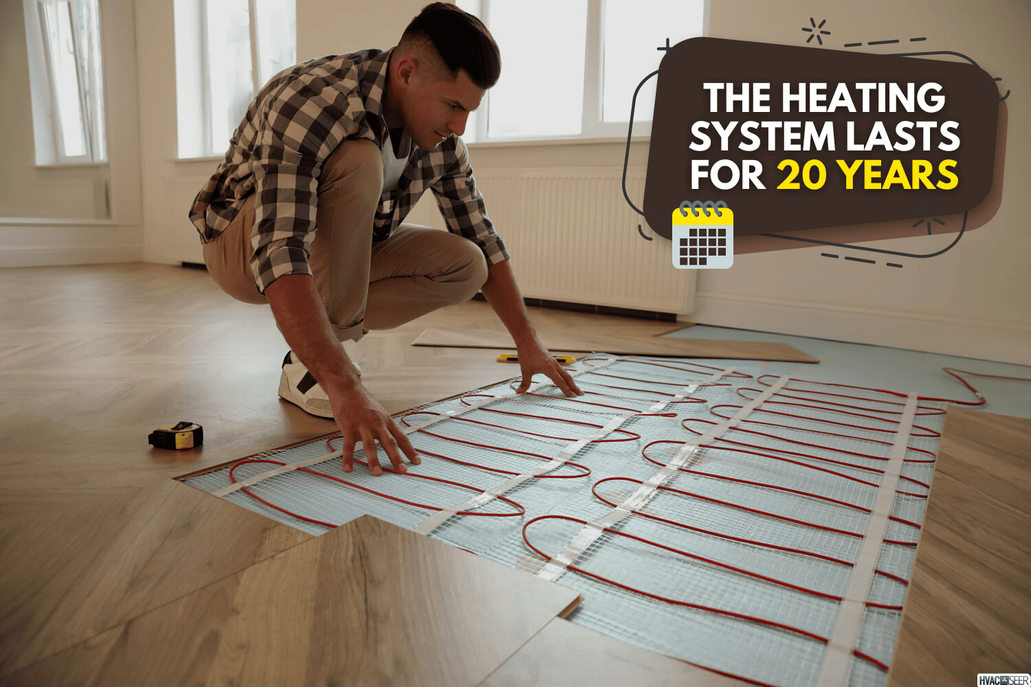 Professional worker installing electric underfloor heating system indoors, Does Ditra Heat Need A Dedicated Circuit