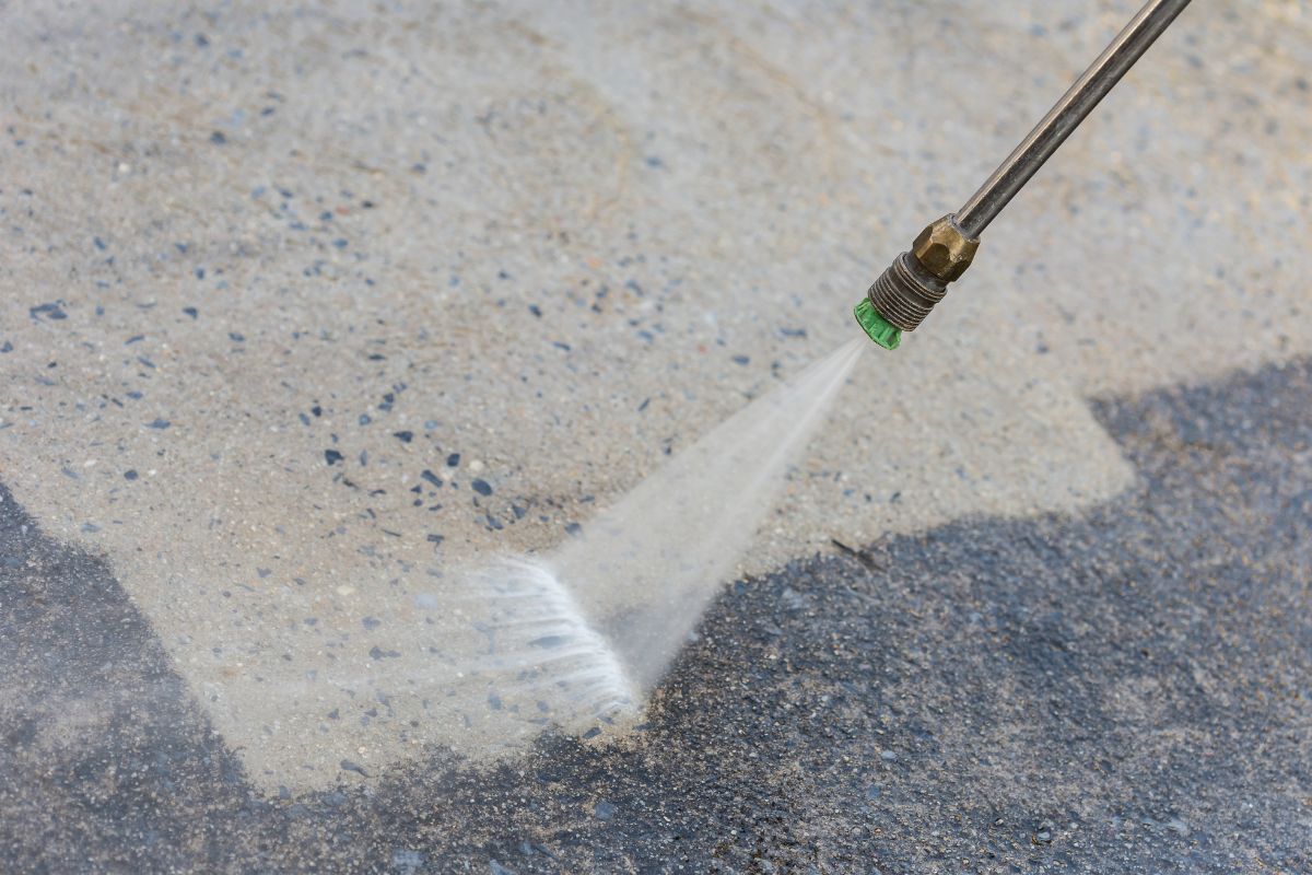 Close up Outdoor floor cleaning with high pressure water jet.
