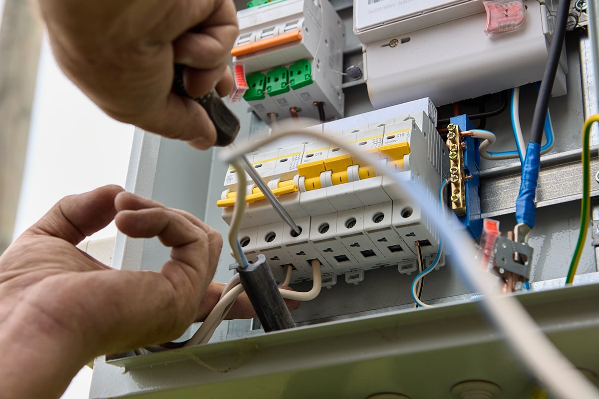 Fastening circuit breakers to DIN rail of consumer unit of electrical panel