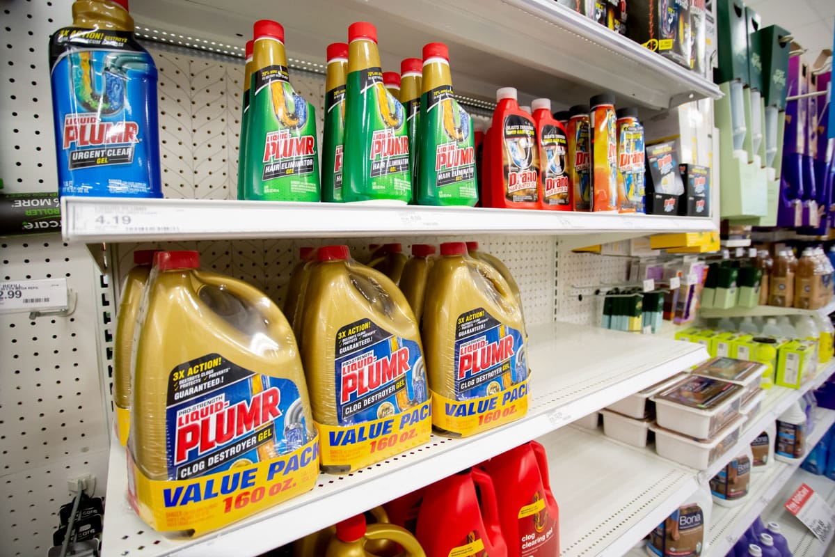 A view of several shelves dedicated to drain cleaning products, on display at a local department store.