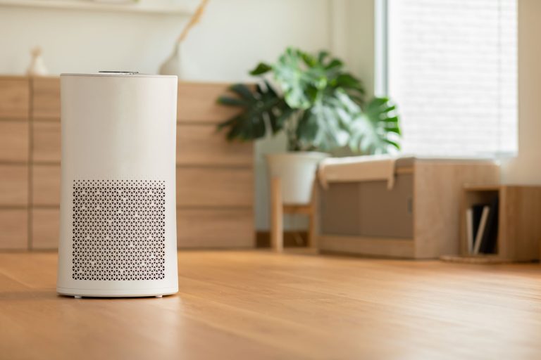 An air purifier placed inside the living room
