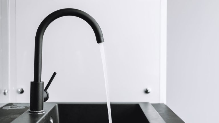 A modern black faucet in the kitchen, Ispring Ro500 Vs Waterdrop G3: Which Is Right For You? - 1600x900