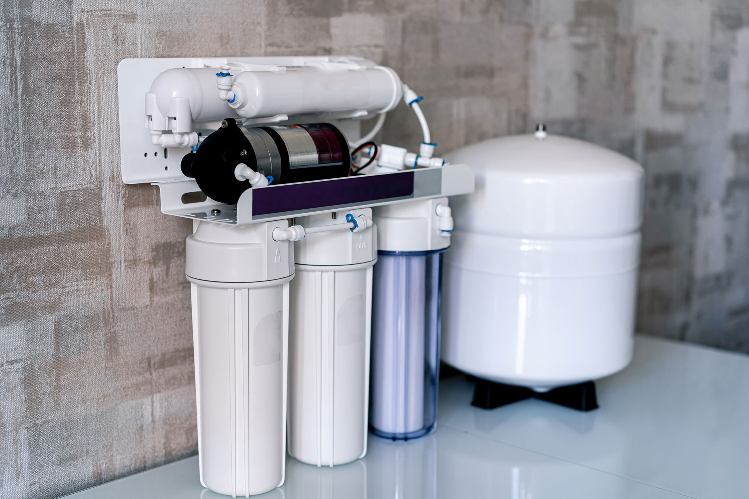 A three-stage filtration system underneath the kitchen sink