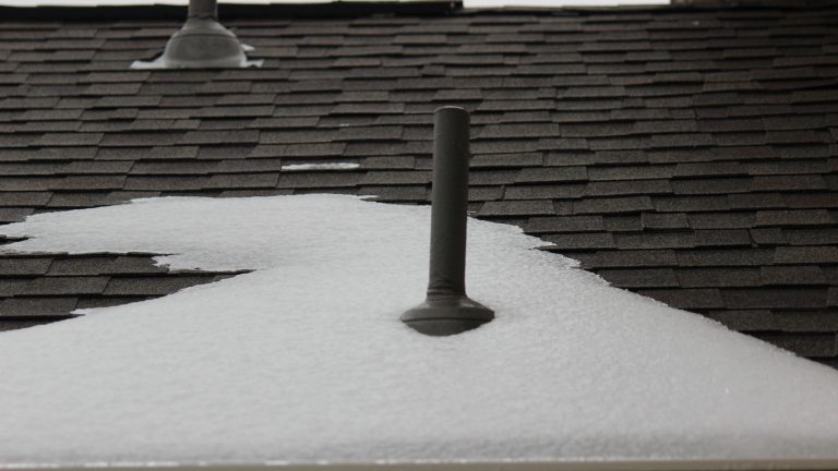 A black painted plumbing vent in the snow, How Big Does A Plumbing Vent Need To Be? - 1600x900