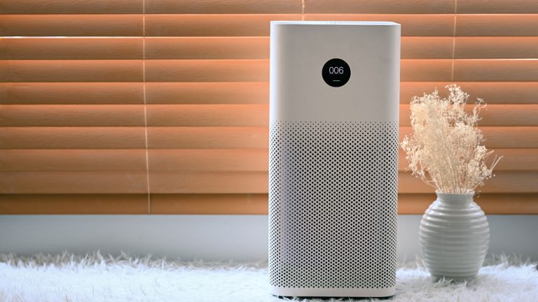 An air purifier in the living room, How Do I Reset My Carrier Air Purifier? - 1600x900