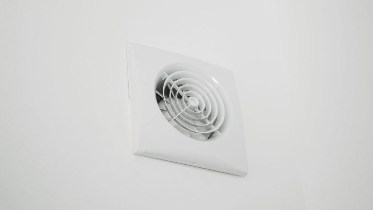 A white extractor fan on the wall, How To Clean A Bosch Extractor Fan & Filter [Step By Step Guide] - 1600x900